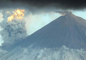 Note the growing pyroclastic cone atop the summit crater,
actively emitting ash.
