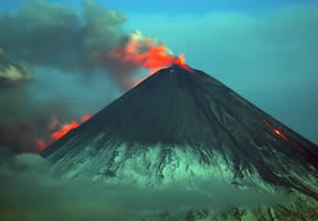 The 15,580-foot Klyuchevskoy Volcano on the Kamchatka Peninsula has been blasting ash into the sky and burbling lava down its flanks, producing a well-monitored hazard to air traffic along the North Pacific Rim.