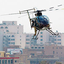 According to a congressional staff report out Monday, private military contractor Blackwater guards use deadly force on a weekly basis in Iraq and have inflicted significant casualties and property damage.