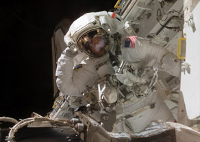 Astronauts on a spacewalk on the International Space Station found metal shavings inside a joint that is needed to turn a set of solar power panels.